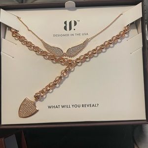 Set of bomb party luxe layer necklace and stud earrings.